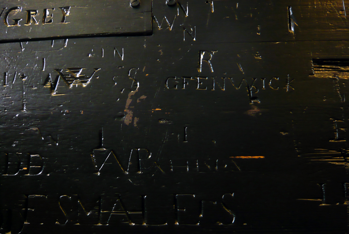 Generations of school boys have left their mark on the building by carving their names into the wooden panelling.